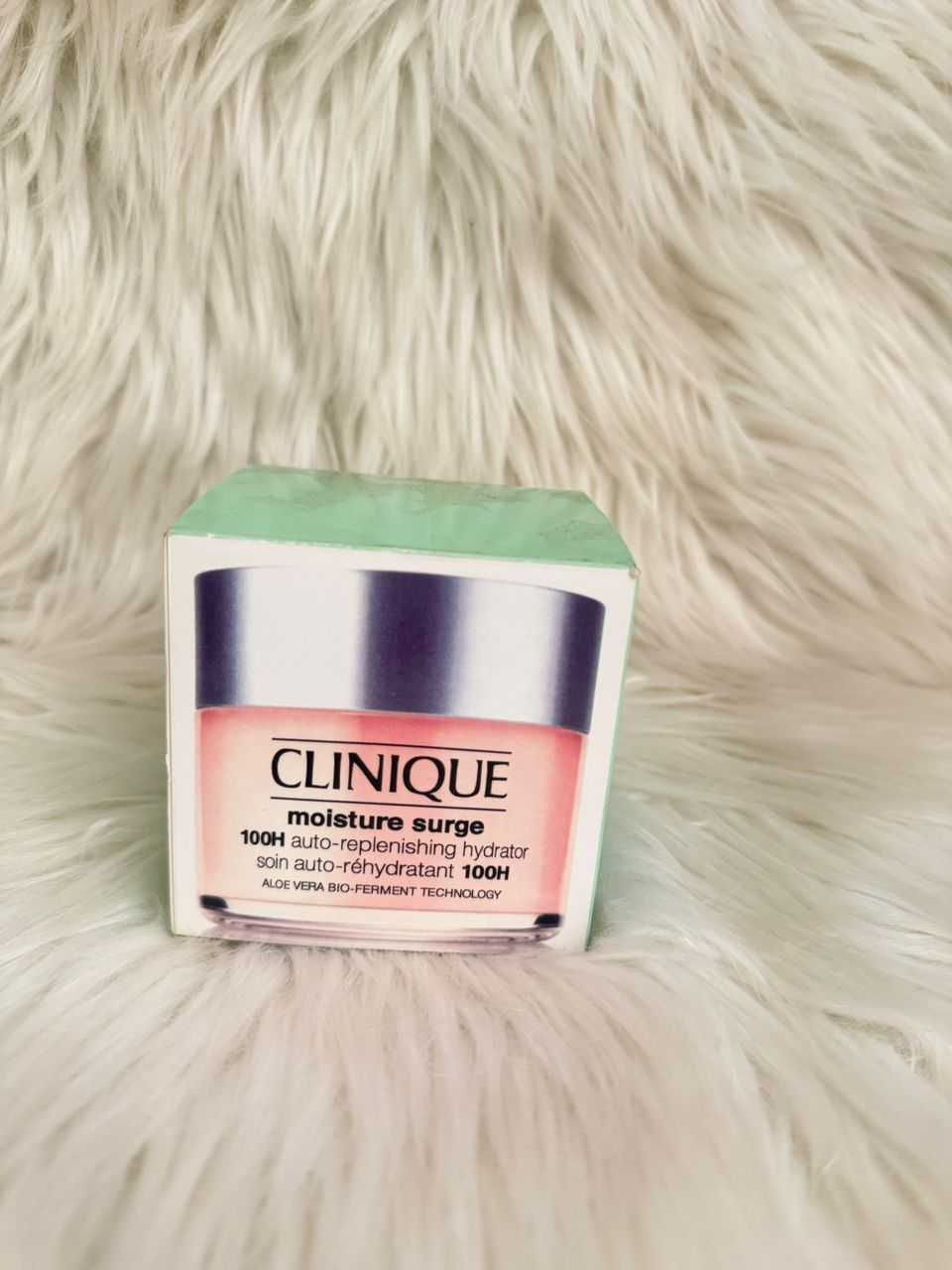 Clinique Moisture Surge 100H auto-replenishing hydrator jar with green lid