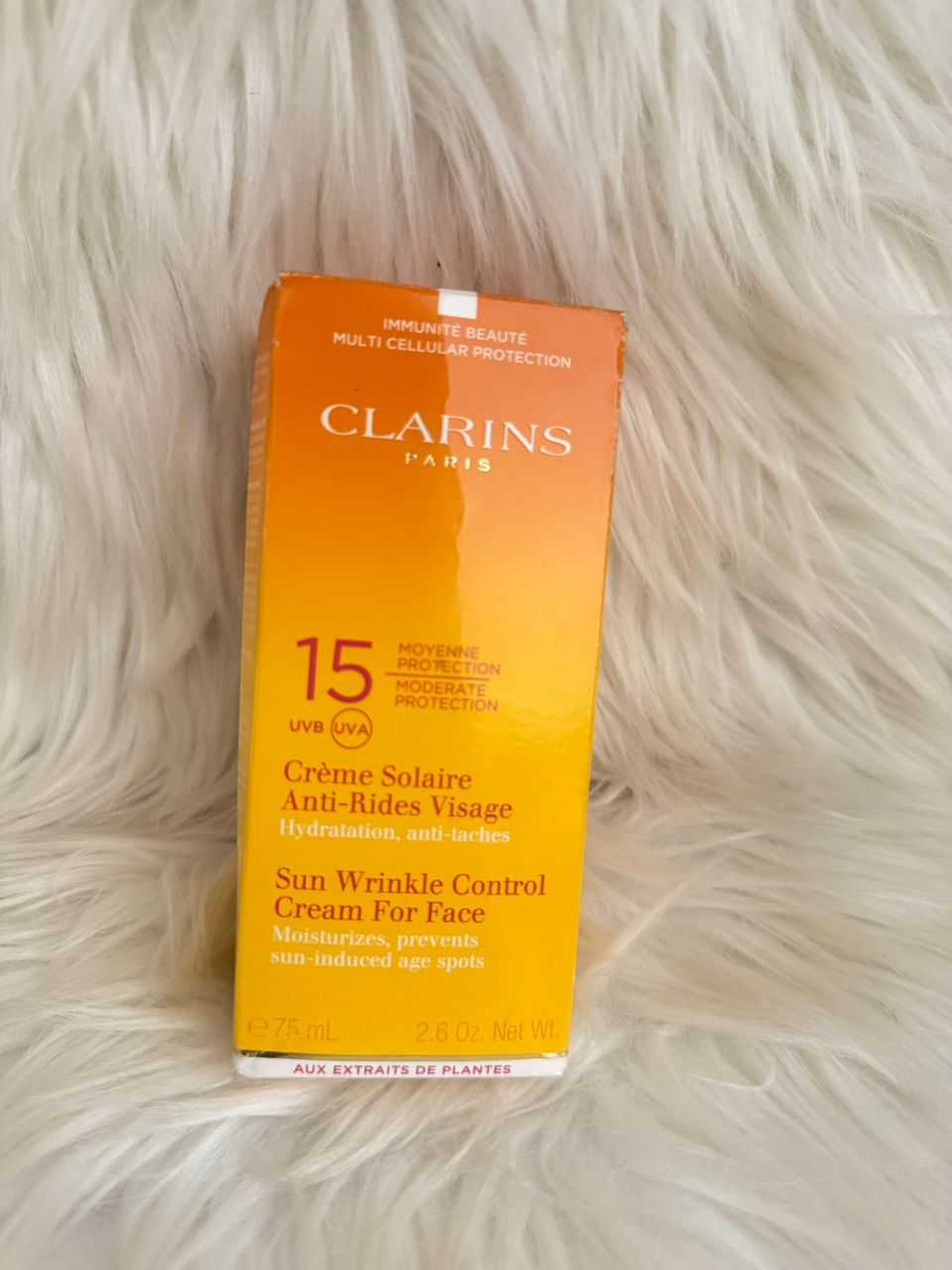 Clarins Sun Wrinkle Control face cream SPF 15 bottle with orange label, anti-rides