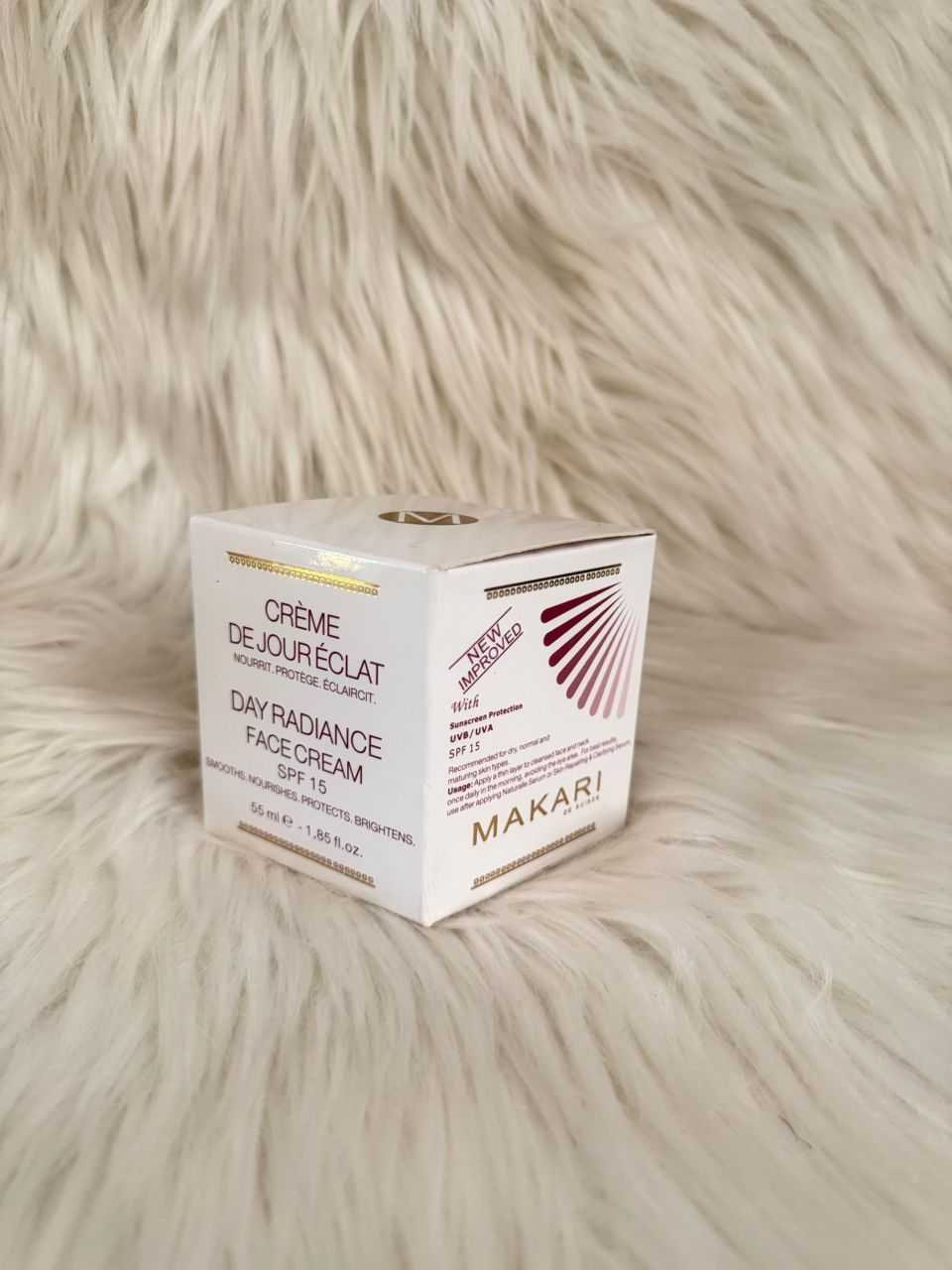 Makari Day Radiance SPF face cream box with cream and gold accents