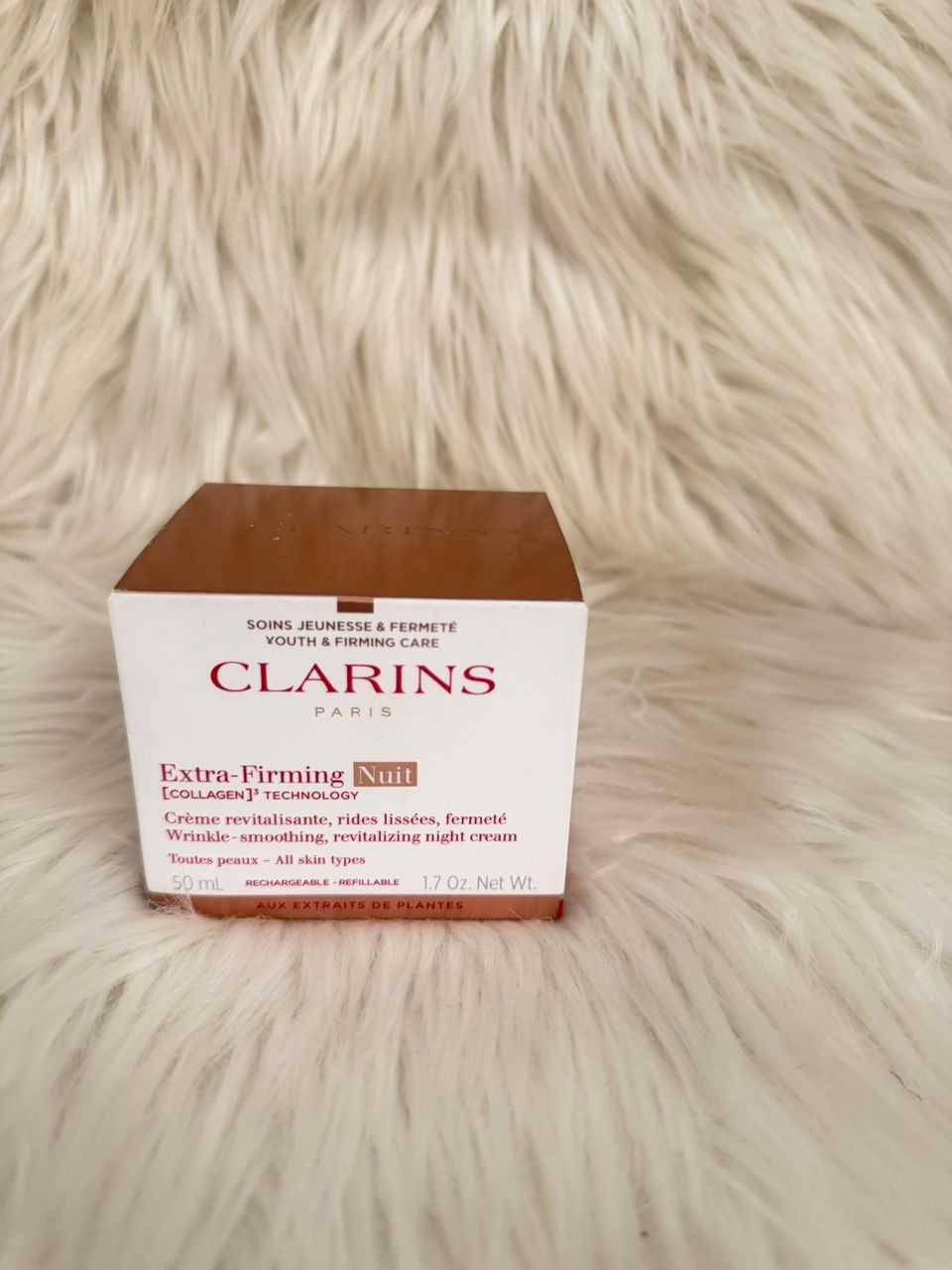 Clarins Extra-Firming Nuit night cream box, white with red text and brown top