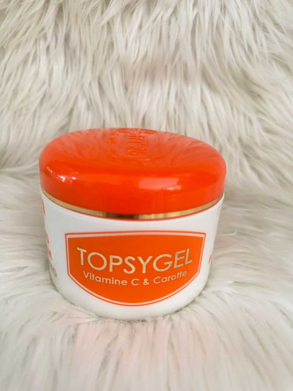 TOPSYGEL cream jar with orange lid and white container