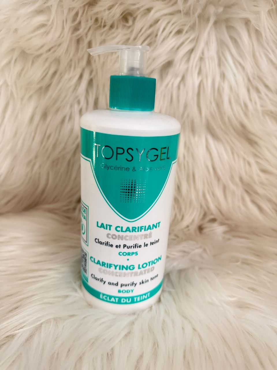 TopsyGel clarifying lotion concentrate bottle with teal cap and white label