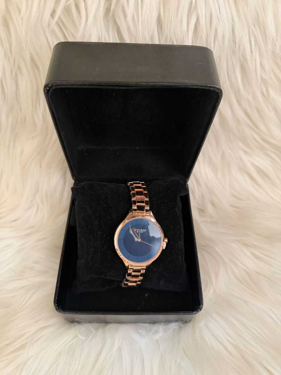 Rose gold minimalist women's watch with blue dial, set in black velvet gift box