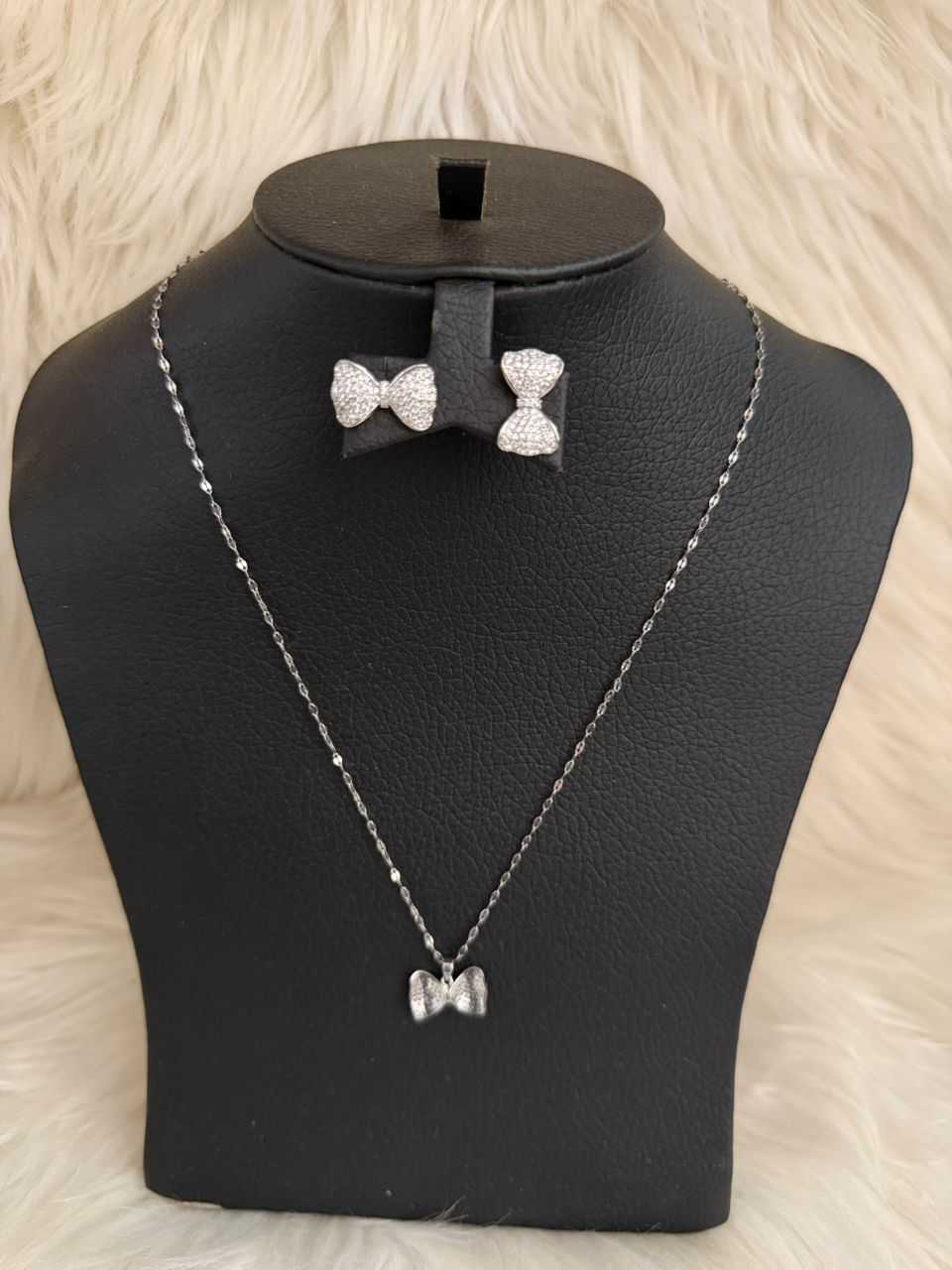 Silver bow jewelry set: bow pendant necklace with matching bow stud earrings