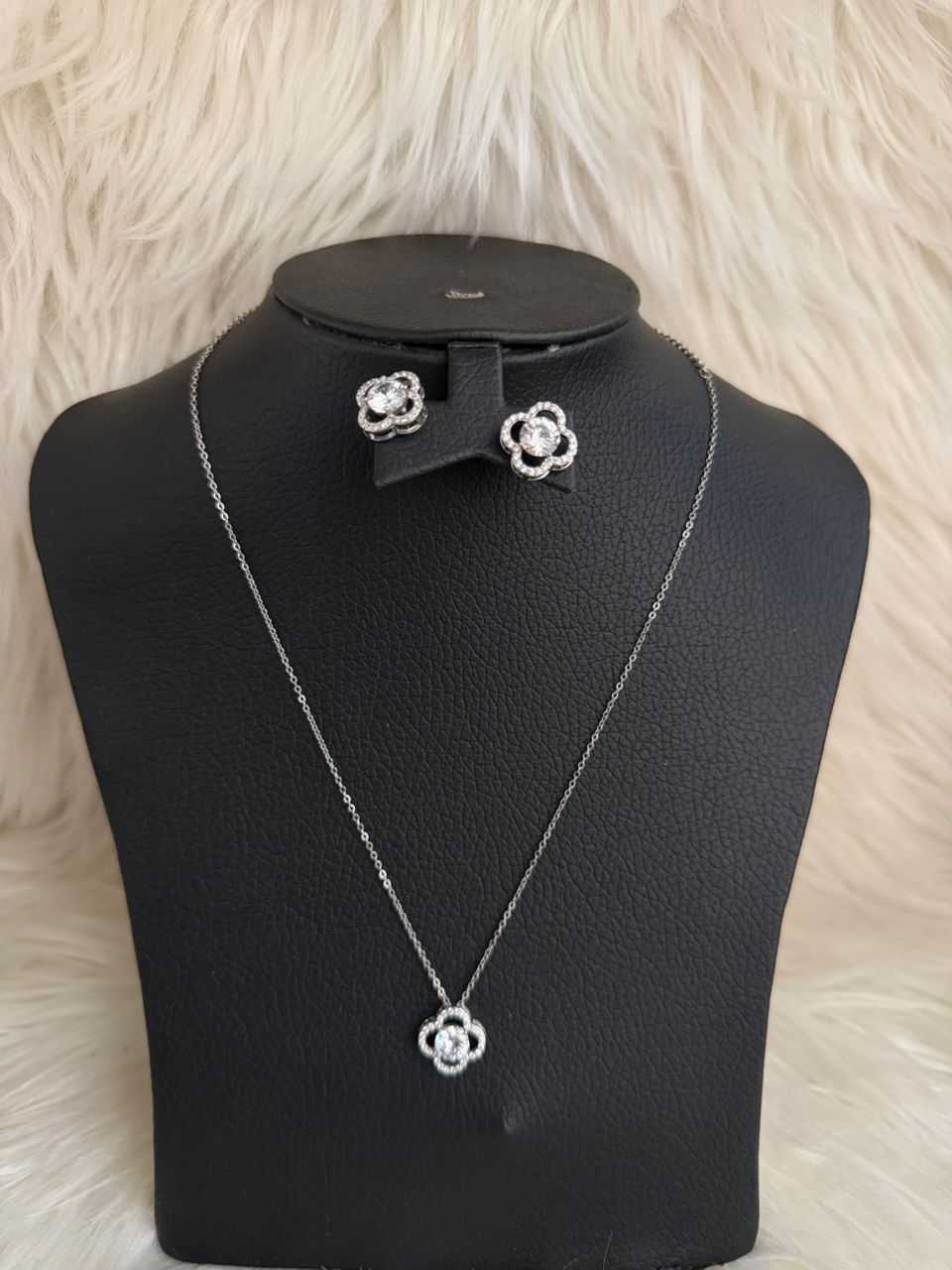 Silver floral jewelry set: pendant necklace and matching stud earrings