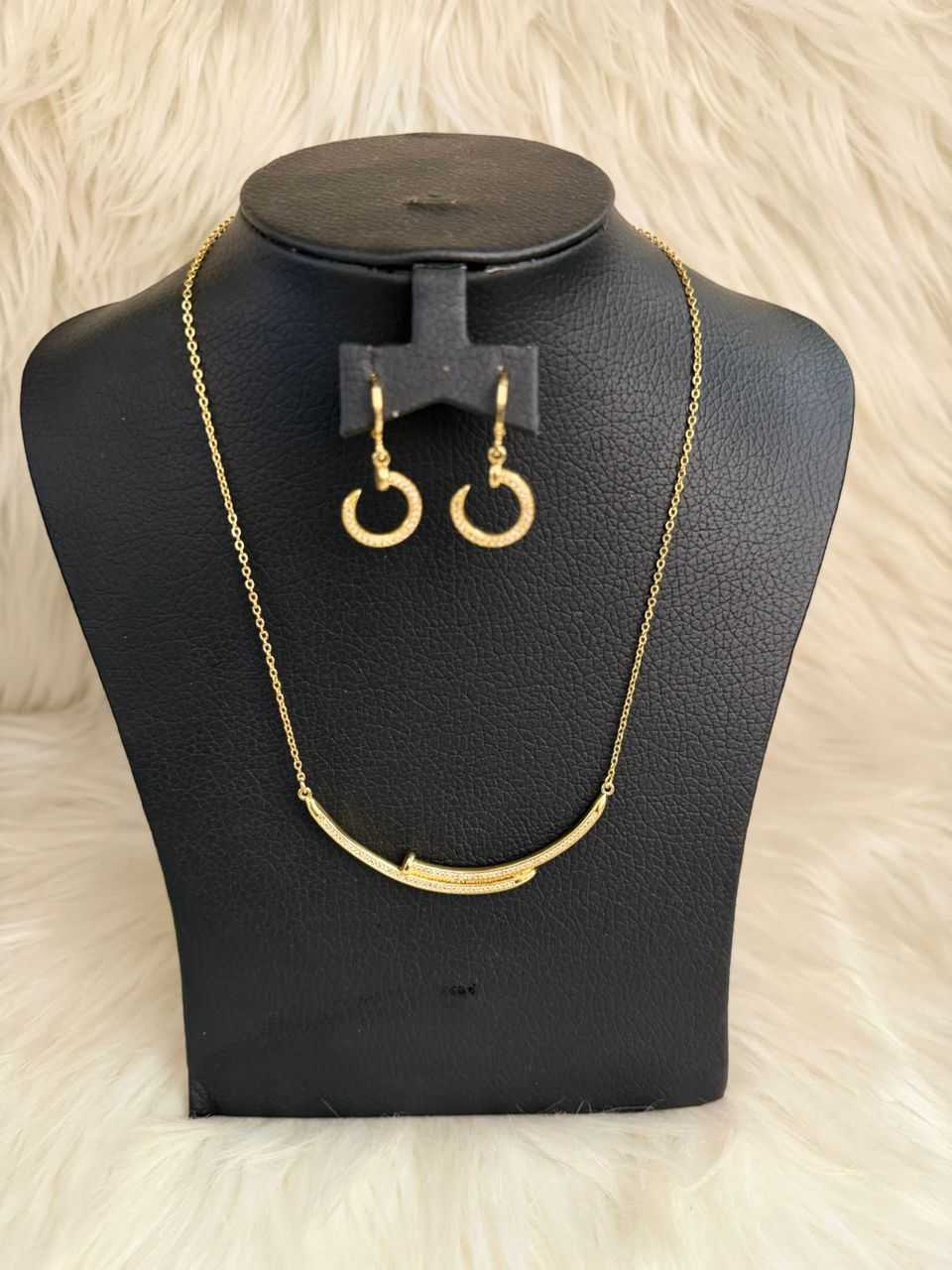 Gold crescent jewelry set with necklace and hoop earrings