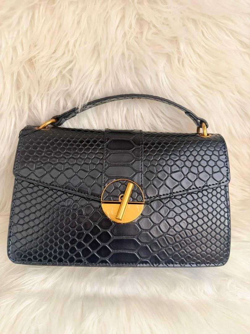 Black snake-texture shoulder handbag with gold-tone clasp and top handle