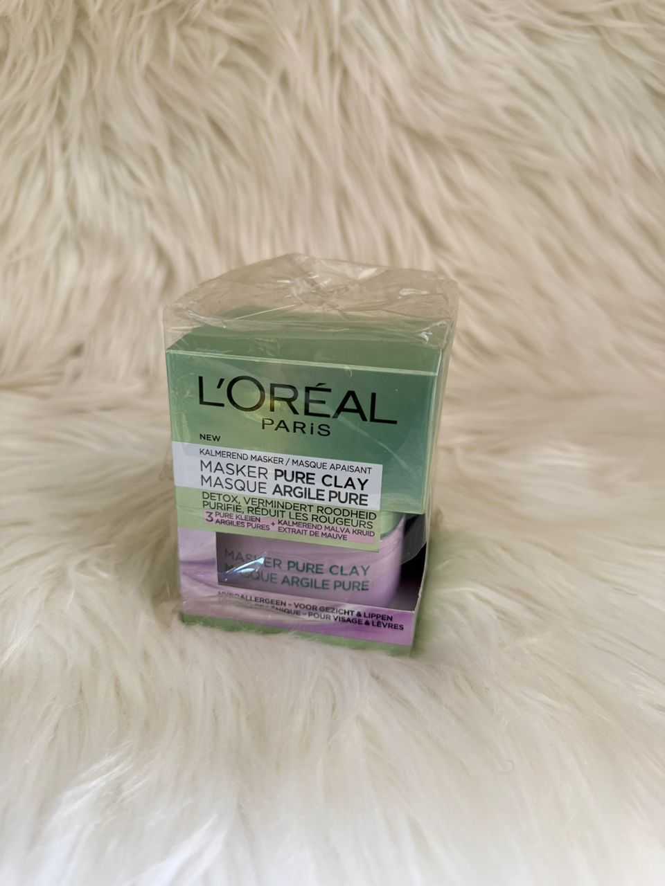 L'Oréal Paris Pure Clay face mask box in green and lavender packaging