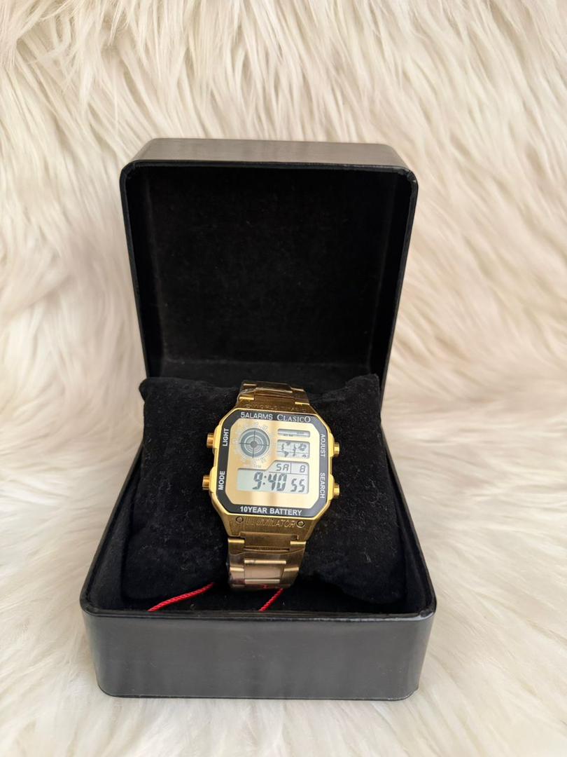 Gold digital wrist watch with black display, in black presentation box