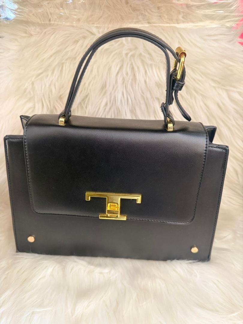 Black structured top-handle handbag with gold clasp and front flap