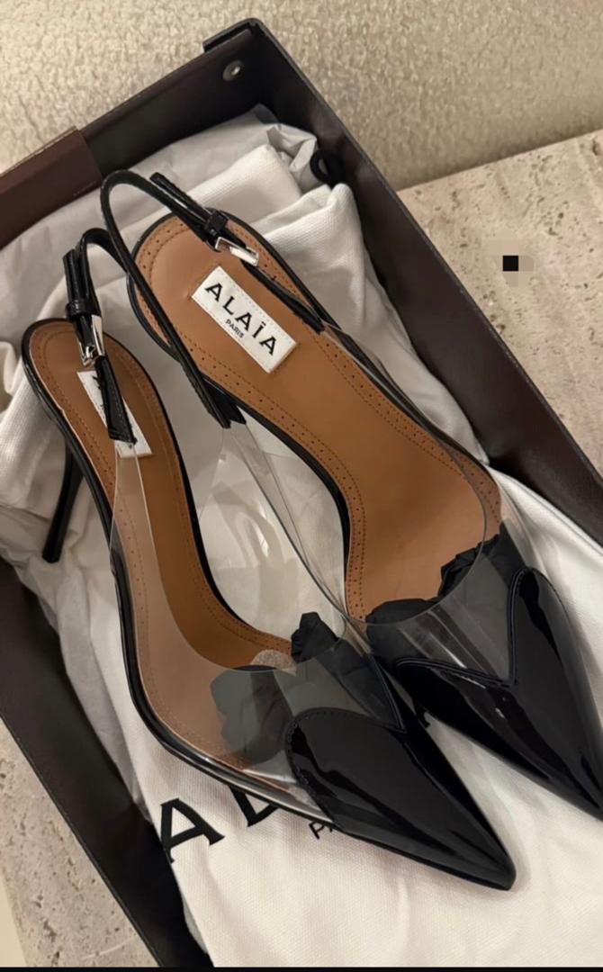 Alaïa black patent slingback pumps with pointed toes and sheer bow fronts