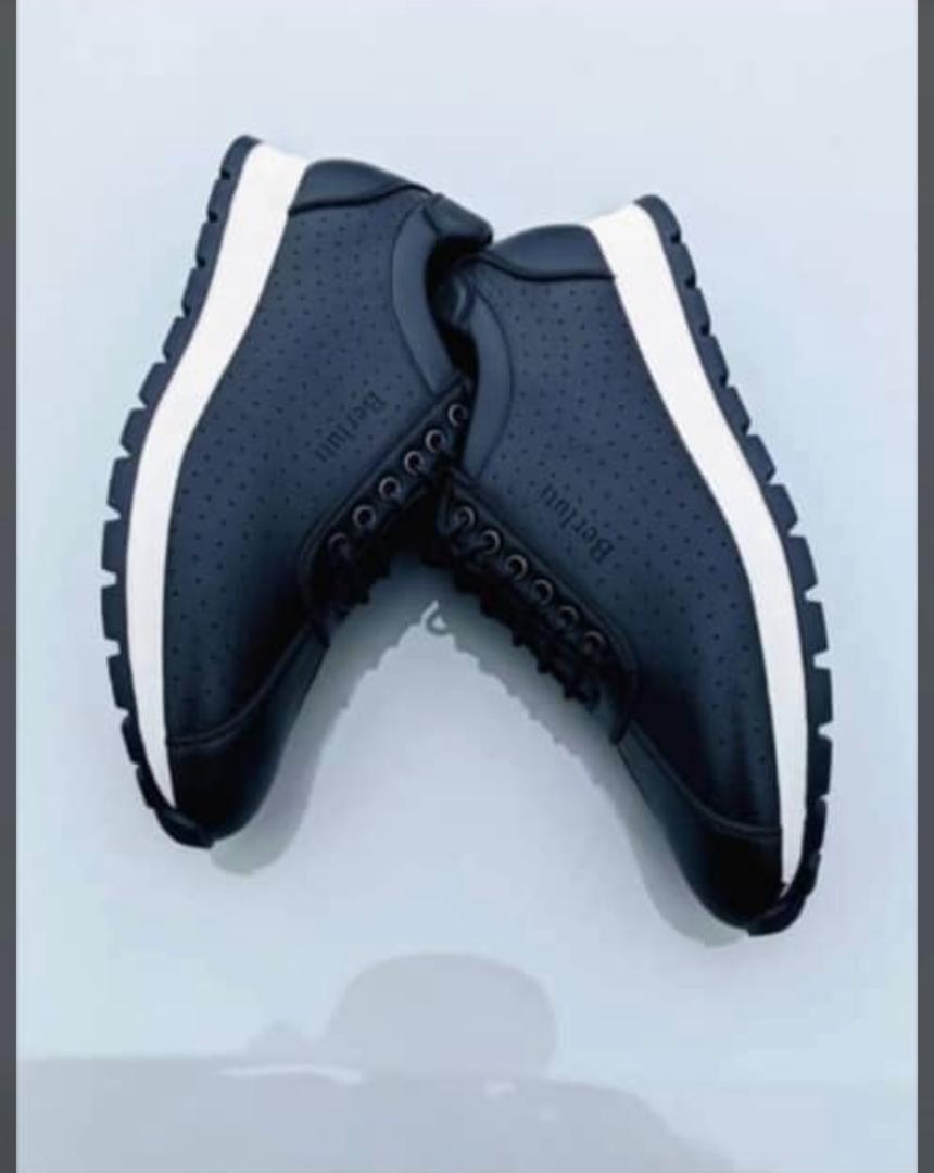 Berluti sneakers in dark blue with perforated sides, black laces, white rubber sole