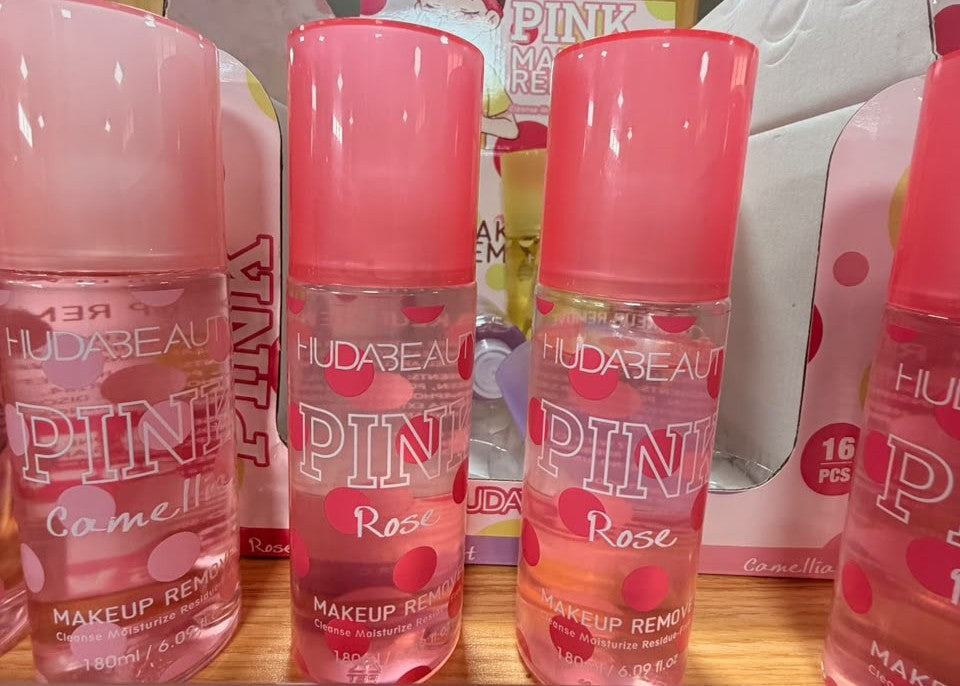Pink makeup remover bottles with rose fragrance, labeled for makeup removal