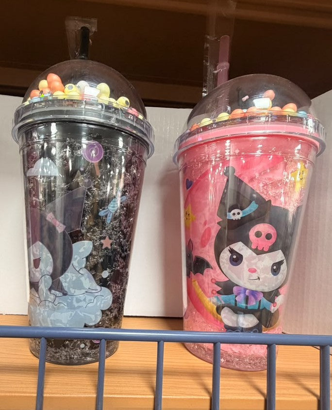 Plastic drink cups with domed lids and straws, colorful cartoon prints