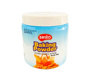 Zesta baking powder tub with white lid, blue label, orange baking ingredient graphics