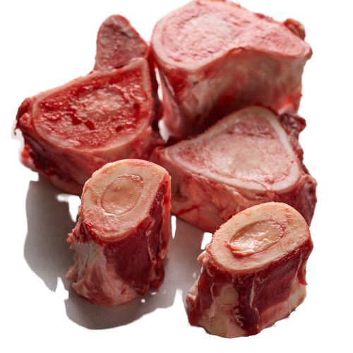 Raw beef bone-in meat pieces, cross-cut with red marrow and fat