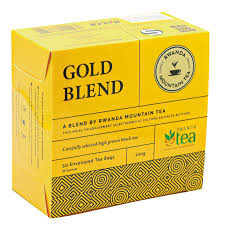 Gold tea blend cardboard box with circular seal and geometric design on sides