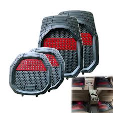 Set of black car floor mats with red perforated grip inserts