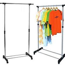 Freestanding single-pole clothes rack with horizontal bars and colorful shirts hanging