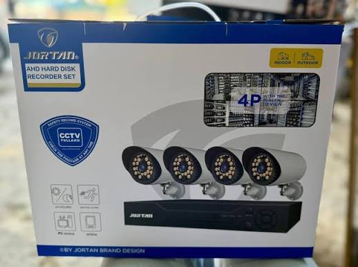 AHD hard disk recorder set box with four round CCTV cameras and DVR unit window