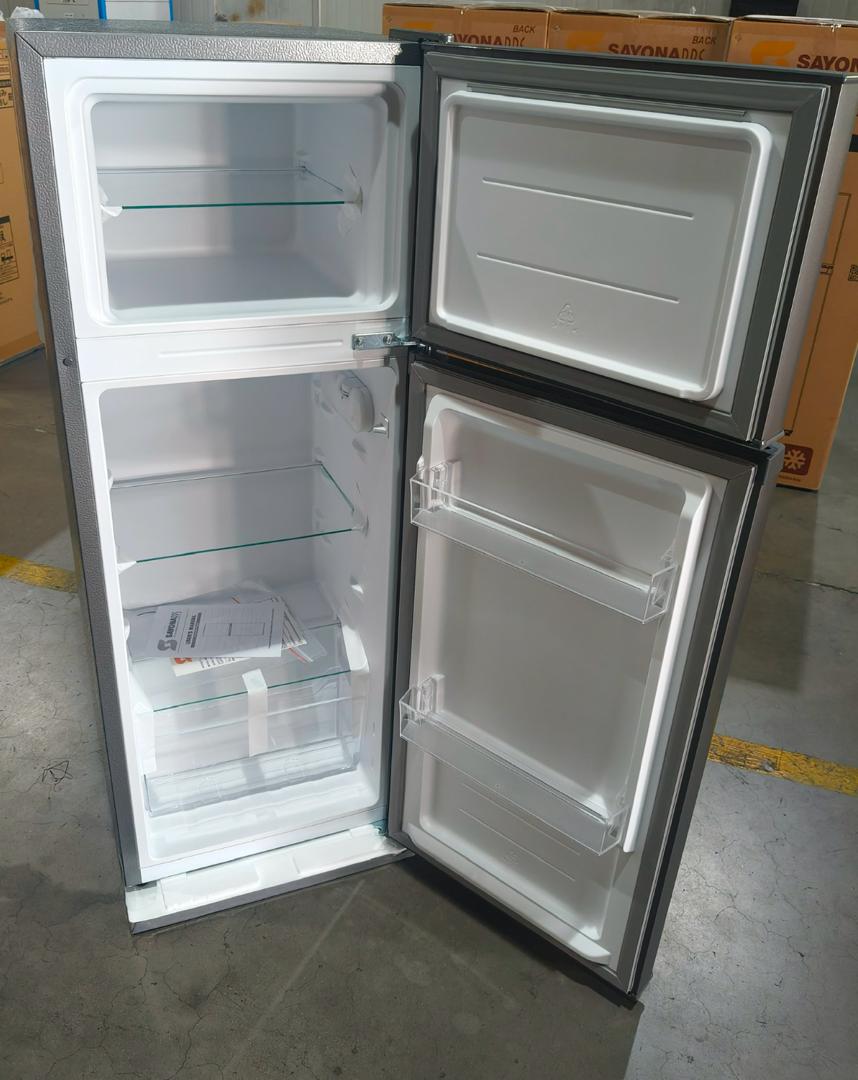 Sayona 107L refrigerator, open doors showing top freezer and two adjustable shelves