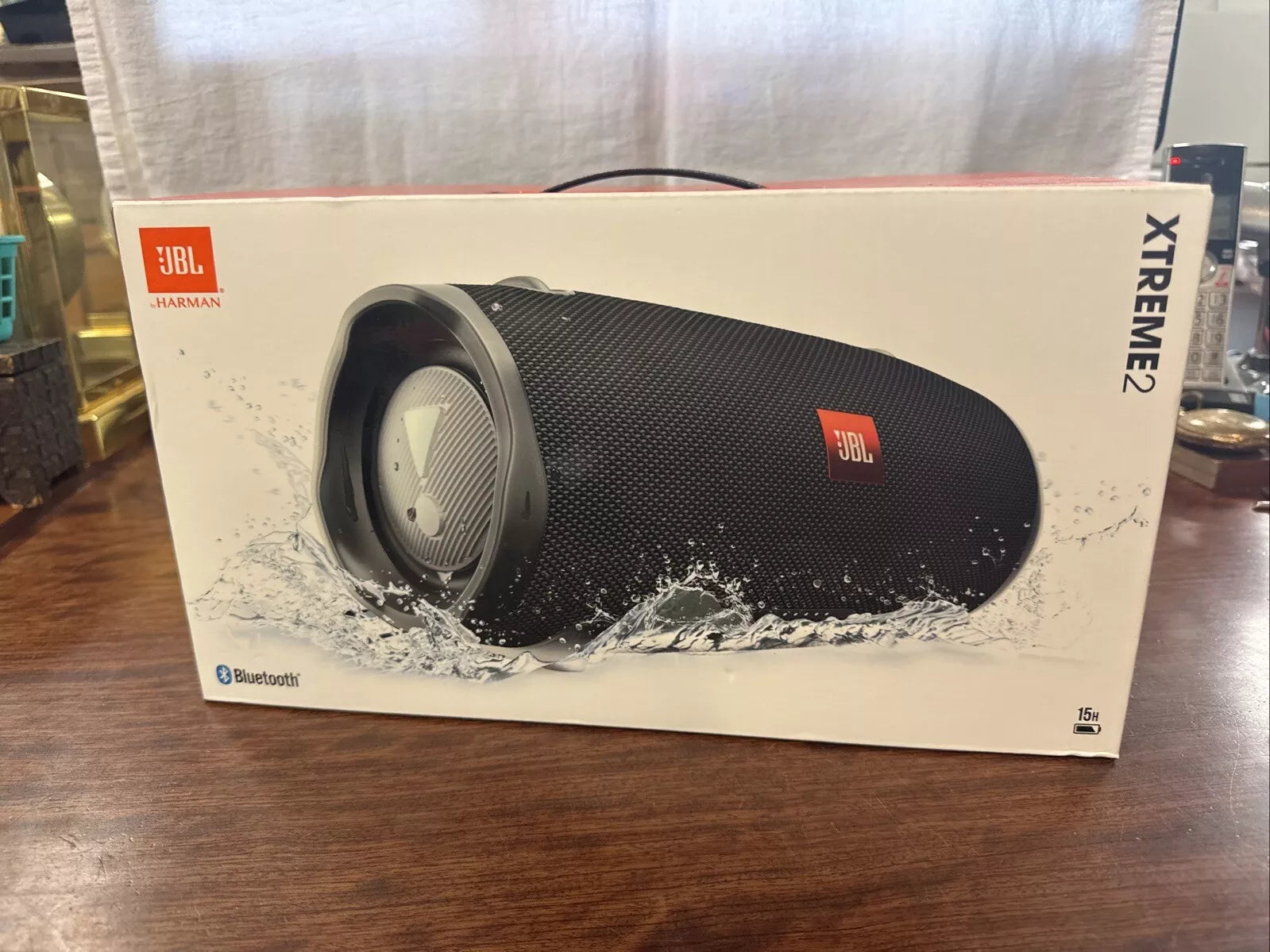 JBL Xtreme 2 portable speaker box with speaker photo and JBL logo